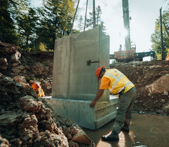 Western Earthworks crew performing road construction on a remote job site in New England